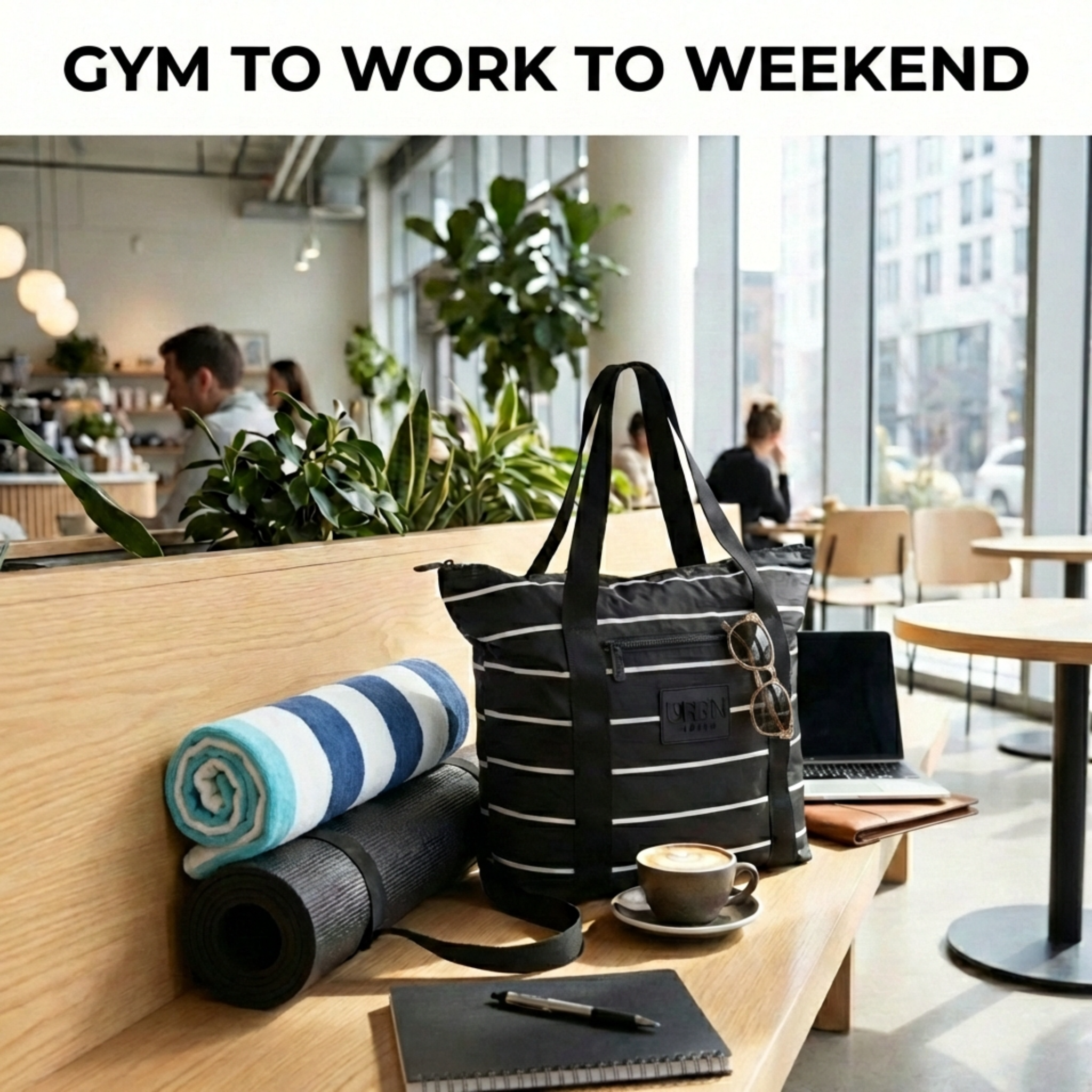 Black tote bag with rolled-up yoga mat to go from the gym to work to weekend adventures.