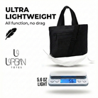 Black tote bag on a scale with text 'Ultra Lightweight' and '5.6 oz light'.